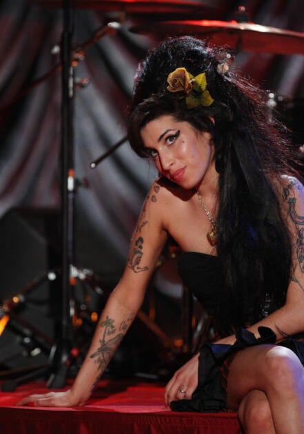 Pop singer Amy Winehouse was buried in a Jewish cemetery even though she had many tattoos. (Wikimedia Commons)
