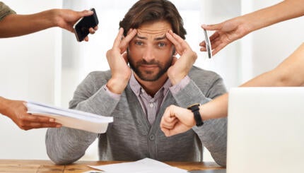A cropped shot of a handsome businessman under strain as colleagues request various things from him